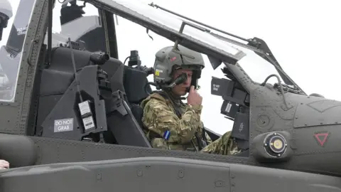 PA Media Prince William in the cockpit of a helicopter