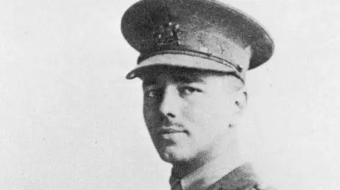 Getty Images A black-and-white image of World War One poet Wilfred Owen in military uniform.