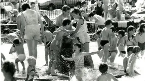Nottingham City Council A black and white image of large numbers children and adults using the pool
