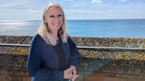 BBC Roz Savage smiling with the sea behind her