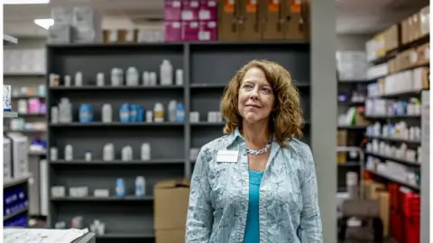 BBC Portrait of Rhonda Francis in the pharmacy