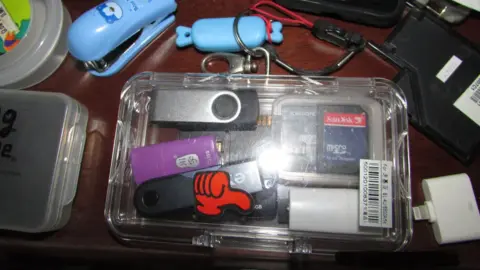 AFP Various electronic devices including USB sticks