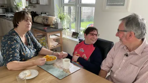 BBC Alasdair Russell with parents Yvonne and Colin