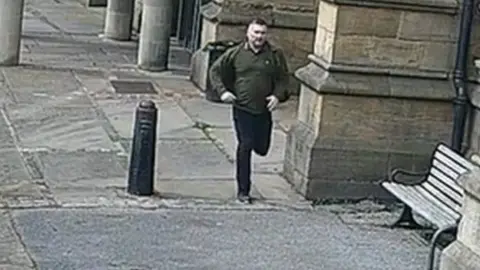 South Yorkshire Police CCTV image of man police want to speak to