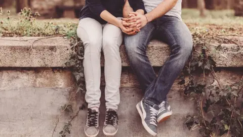 Getty Images Teenagers holding hands