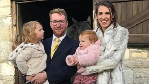 Family photo Tom and his wife Laura and their daughters