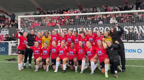 Chatham Town pose with the fans after beating York City 3-0 at home to progress the the fifth round of the Women's FA Cup