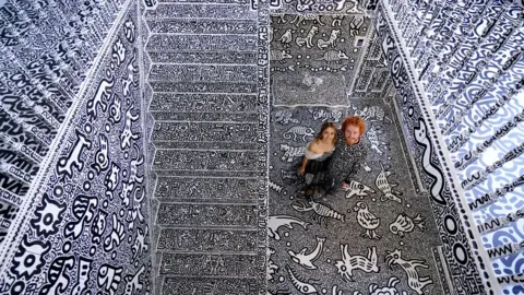 PA Media Sam Cox and his wife Alena at their home in Tenterden, Kent