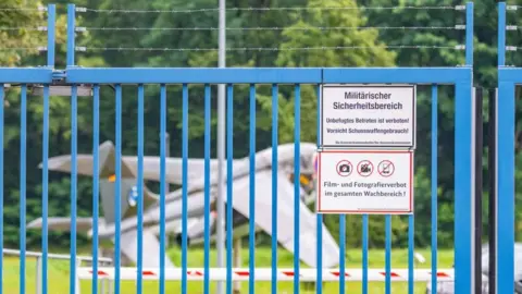  BENJAMIN WESTHOFF/EPA-EFE/REX/Shutterstock A military security area in front of the Bundeswehr barracks Cologne-Wahn, in Cologne, Germany, 14 August 2024