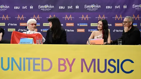 EPA Joost Klein (L) representing the Netherlands with the song 'Europapa' and Eden Golan (2-R) representing Israel with the song 'Hurricane' during a press meeting with the entries that advanced to the final after the second semi-final of the 68th edition of the Eurovision Song Contest (ESC) at the Malmo Arena, in Malmo, Sweden, 09 May 2024.