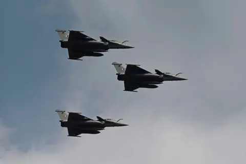 AFP Indian Air Force's Rafale fighter jets fly on 3 February 2021 during the first day of Aero India 2021 Aircraft at Yelhanka Air Force Station in Bangalore.