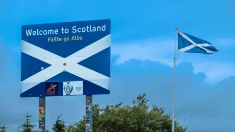 Getty Images An image of the Welcome to Scotland sign on the A68 road across the Scotland-England border