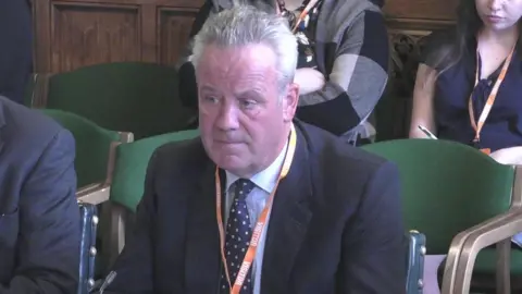 Thames Water boss Chris Weston speaks to MPs in a committee
