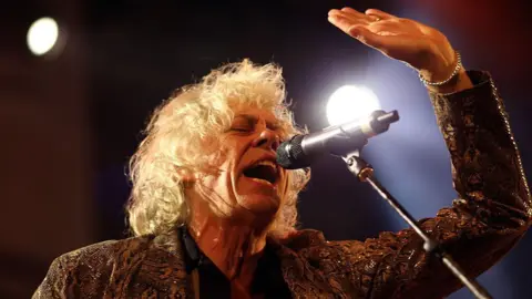 Getty Images Bob Geldof of The Boomtown Rats sings in to a microphone at Weyfest Festival on August 21, 2016 