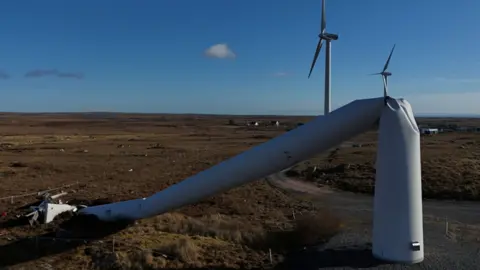 Reuters A wind turbine is partially collapsed from high winds during Storm Éowyn in the Republic of Ireland. 