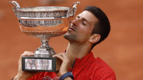 Novak Djokovic holding the French Open trophy