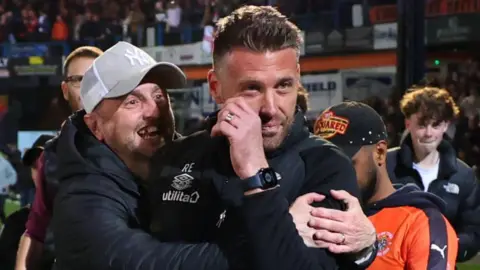 Getty Images Luton Town manager Rob Edwards mobbed by fans at the play-off semi final on Tuesday night at Kenilworth Road, Luton Semi-Final Second Leg match 