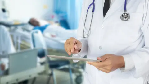 Getty Images A doctor on a hospital ward