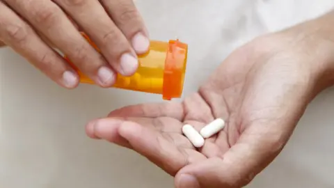 Getty Images Person holding antibiotics