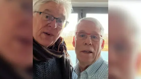 Bryan Urbick A selfie of two men with glasses and white hair.