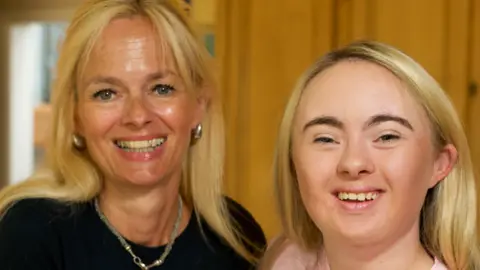 Ellie Lane and her mum Jane, both smiling at the camera