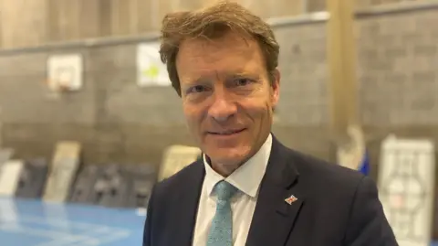 Richard tice wearing a dark blue suit at the election count in 2024