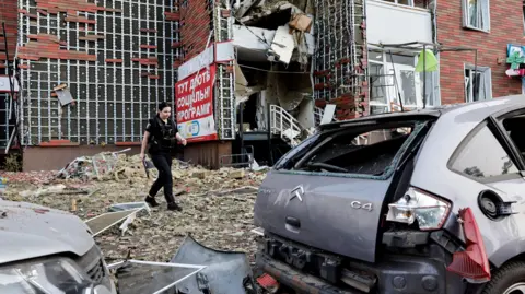 Reuters An apartment building damaged after the Russian drone strike on Kyiv