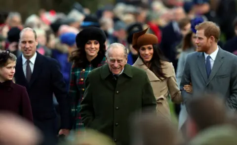 Reuters Prince Philip, the Duke of Edinburgh, leads Prince William, Duke of Cambridge, Catherine, Duchess of Cambridge, Meghan Markle and Prince Harry. Crowds can be seen in the background. 