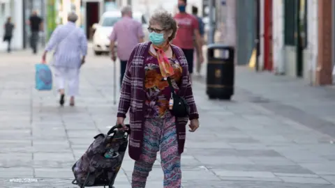 Woman shopping in Bridgend town centre