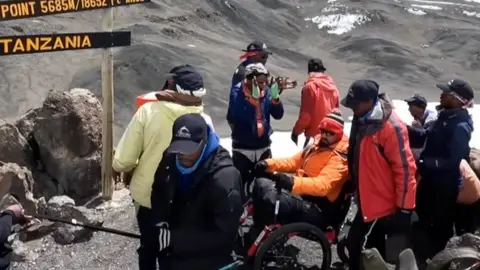 Martin Hibbert as he reaches Gilman's Point summit on the mountain