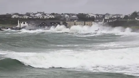 Shropshire Liam | BBC Weather Watchers Wild waves crashing against the seafront in Trearddur Bay, Anglesey. 