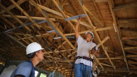 Getty Images Construction workers, Louis Delgado (L) and Tony Rodriguez work on building a Toll Brothers Inc. home on September 26, 2012 in Boca Raton, Florida