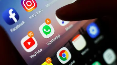 YUI MOK/PA WIRE The WhatsApp app on a phone