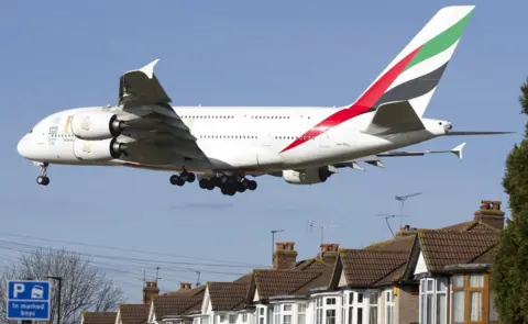 Getty Images Airbus A380 low over residential housing