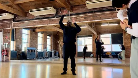 BBC/NATHAN TURVEY A picture of visually impaired people taking part in the dance workshop