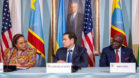 AFP via Getty Images Two months ago, on 25 April, US Secretary of State Marco Rubio (C), Rwandan Foreign Minister Olivier Nduhungirehe (R) and Democratic Republic of the Congo Foreign Minister Therese Kayikwamba Wagner sign of a Declaration of Principles between the two countries in the Treaty Room of the State Department in Washington DC.