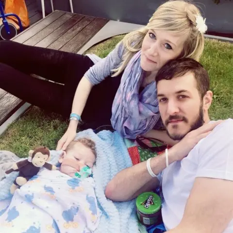Featureworld Baby Charlie Gard on rooftop of Great Ormond Street hospital with his parents Charlie Gard