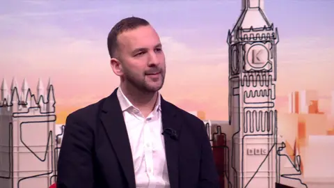 Zack Polanski at the SWLK studio, looks to his right