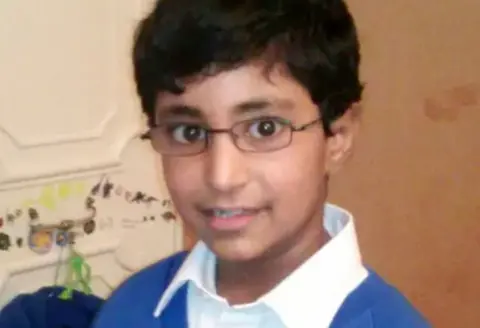 Family photograph  Karanbir Cheema successful  his schoolhouse  uniform