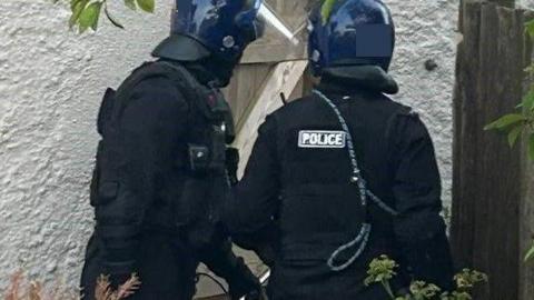 Police during a raid
