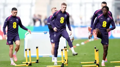 PA Media England's Cole Palmer (centre) and team-mates during a training session at the Ernst-Abbe-Sportfeld in Jena, Germany. 
