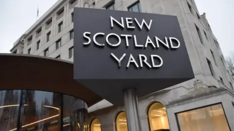 Met Police New Scotland Yard sign