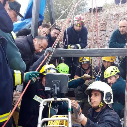 EPA A handout photo made available by the Andalusian Government shows rescue teams working at the borehole where two-year-old boy Julen fell into back on 13 January