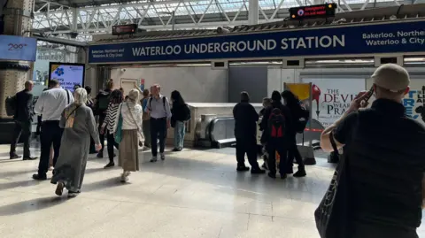 Waterloo station passengers outside closed Underground