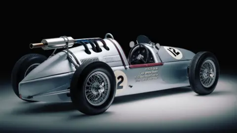 Gunhill Studios The RA4 Vanguard Grand Prix car, a silver low car with an open car seat and the number 12 displayed on its side