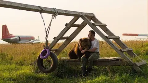 Instagram/mansurebear Mansur the Russian bear who lives at an airfield, 2019
