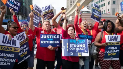 Getty Images UAW workers demonstrate