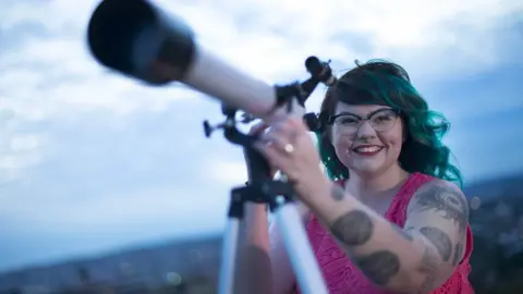 University of Newcastle Karlie Noon with a telescope