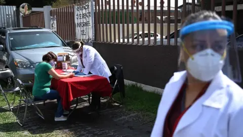 AFP A woman fills out a form to donate blood in Mexico City on 30 June 2020