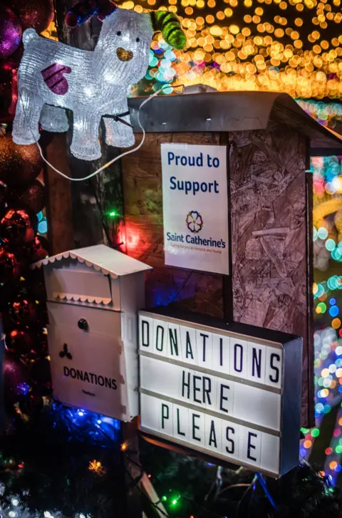 Jenny Boe Photography Picture of lights and donation box